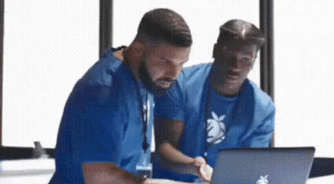 Drake points at a laptop and Lil Yachty reacts with a moment of realization.